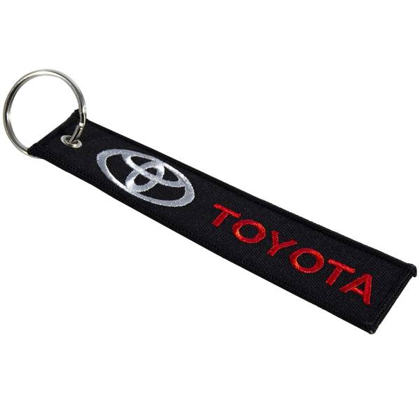 Брелок автомобильный марка TOYOTA ( ТОЙОТА ) вышитый полоса ( лента ) 13х3 черный (4402979) - HAKKI
